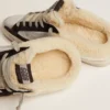 Zapatillas Super-Star Sabot para mujer en cuero laminado plateado con estrella negra