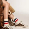 Zapatillas Super-Star Sabot para mujer en piel de potro con estampado de leopardo y estrella negra